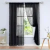 black curtains Elegant black floor-length plain sheer curtains hanging from a sleek antique finish curtain rod installed on a small window—creating a modern, flowing look while maintaining privacy and natural light.