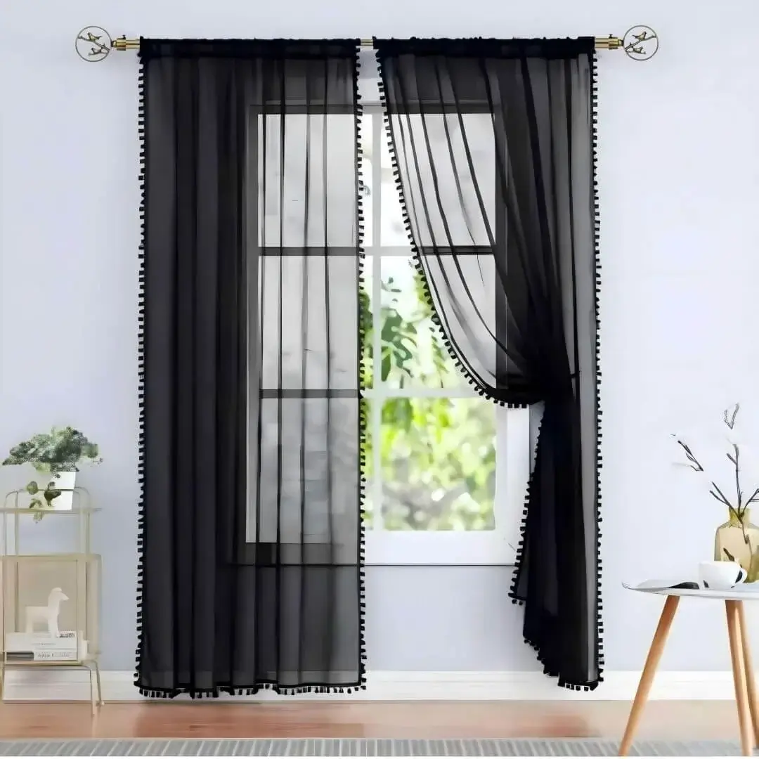 Elegant black floor-length plain sheer curtains hanging from a sleek antique finish curtain rod installed on a small window—creating a modern, flowing look while maintaining privacy and natural light.