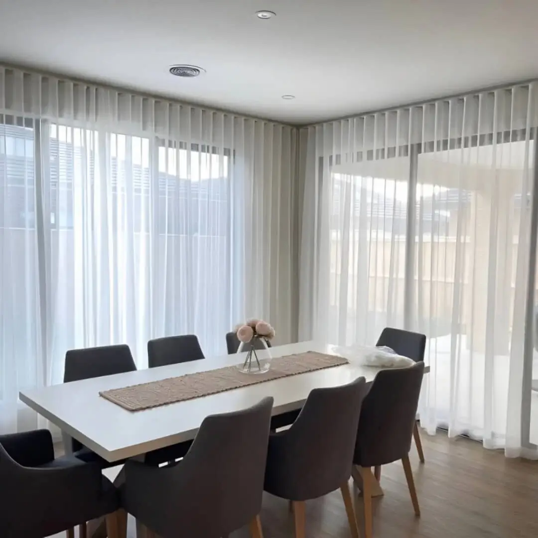 curtain track for dining rooms, ceiling mounted curtain track, elegant sheer curtains hanging on a ceiling mount curtain track in a dining room creating an inviting ambiance.