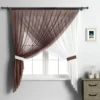 curtains for bedroom Elegant sheer curtain gracefully hanging from a sleek black curtain rod installed on a small window, creating an airy and sophisticated look