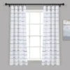 curtains with rod Elegant checks curtain gracefully hanging from a sleek black curtain rod installed on a small window, creating an airy and sophisticated look
