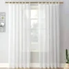 golden curtain rod for windows Elegant sheer curtain gracefully hanging from a luxurious gold curtain rod installed on a small window, creating an airy and sophisticated look