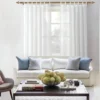 living room curtain Elegant sheer curtains cascading from a luxurious gold curtain rod in a stylish living room, featuring a cozy sofa set and modern center table—creating a bright, airy, and sophisticated ambiance