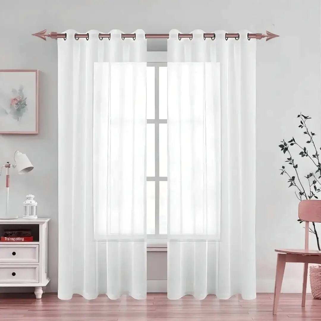 Elegant black floor-length sheer curtains hanging from a sleek rose curtain rod installed on a window—creating a modern, flowing look while maintaining privacy and natural light
