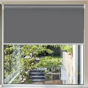 roller blinds for windows, Grey blackout roller blind installed on a window, showcasing seamless light-blocking and a sleek modern design for complete privacy and darkness