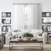 rose gold curtain rods in living room Stylish living room with flowing net curtains on a rose gold curtain rod, paired with a cozy sofa set, nice cushions, and wall paintings—creating a chic, inviting ambiance