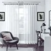 100 inches adjustable curtain rod set pewter grey grey pewter finish curtain rod for living room, Stylish living room with flowing sheer curtains on a grey pewter finish adjustable curtain rod 100 inches set, paired with a single seater, and a table —creating a chic, inviting ambiance. Text highlight '100 inches'