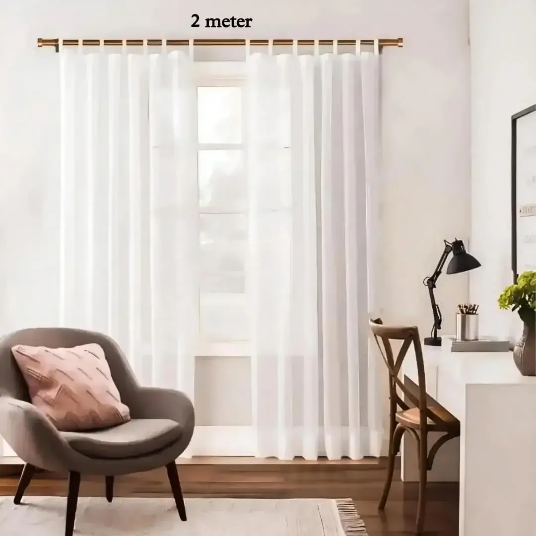 adjustable curtain rod 2m set copper colour for living room, Stylish living room with flowing sheer curtains on a copper finish adjustable curtain rod 2 meter set, paired with a single seater, and a table —creating a chic, inviting ambiance. Text highlight '2 meters'