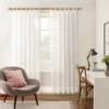 bronze colour living room curtain rod bronze finish curtain rod for living room, Stylish living room with flowing sheer curtains on a bronze colour curtain rod, paired with a single seater, and a table —creating a chic, inviting ambiance.