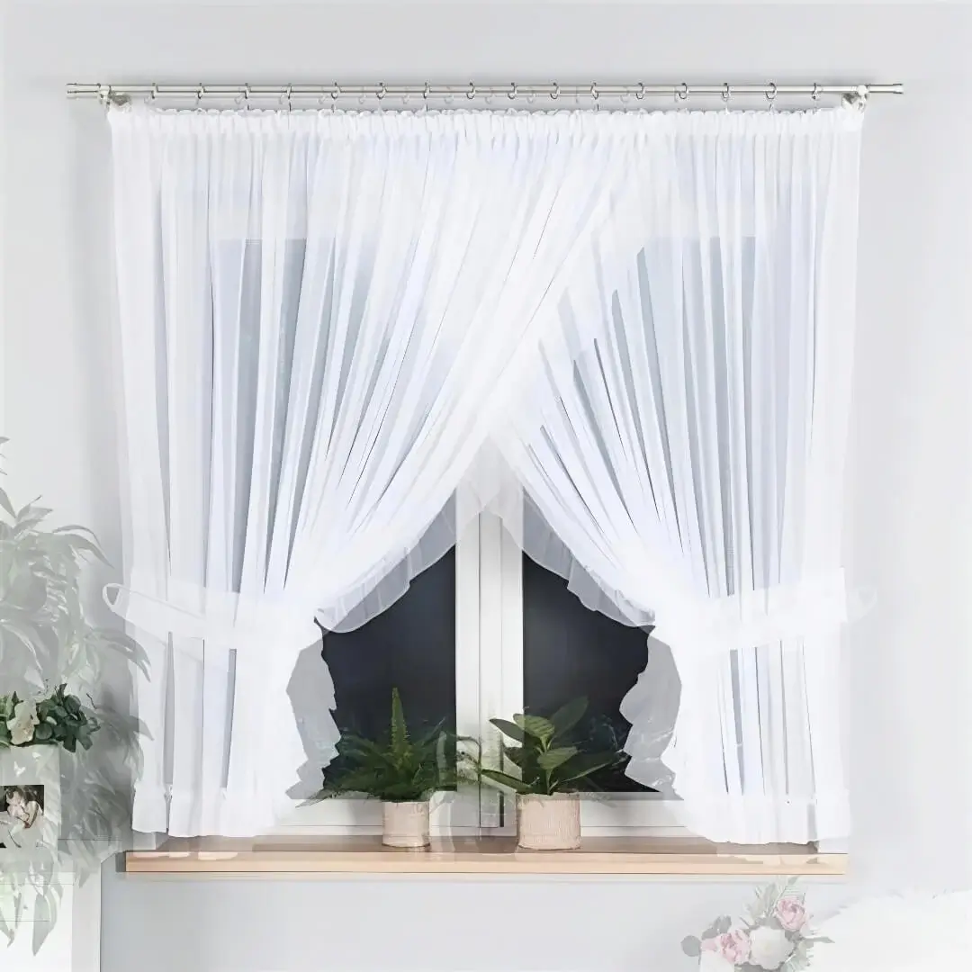 rods for voile curtains, rods for sheer curtains, Stylish white pencil pleat curtains in lightweight voile fabric, gracefully hung on sleek pewter gray-finish curtain rods to frame a cozy bedroom window. The sheer material softly filters sunlight, creating a serene and chic ambiance—perfect for modern minimalist interiors.