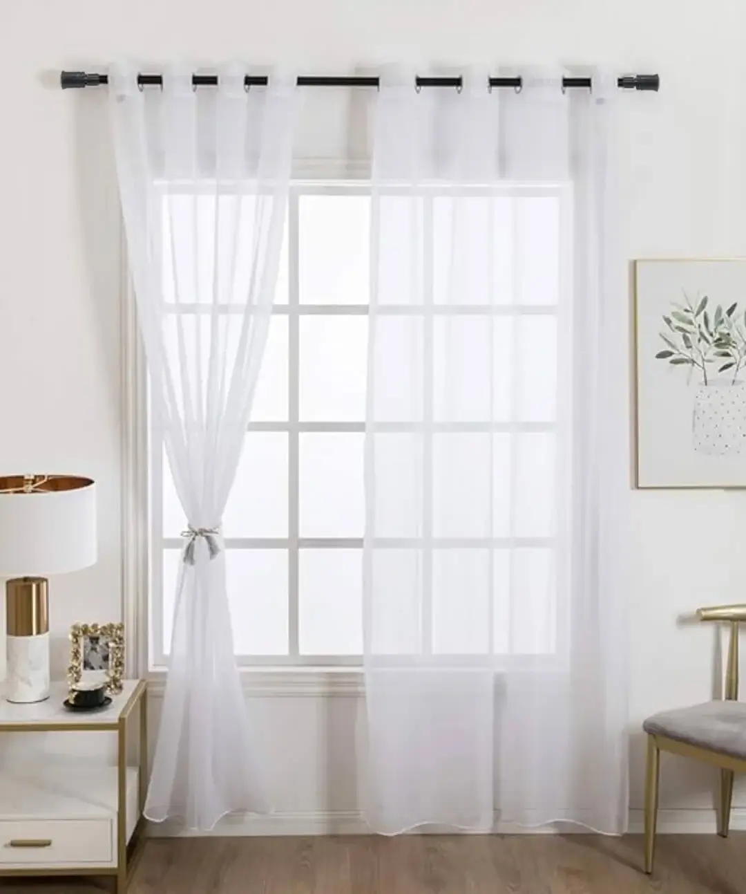 curtain rods for sheer curtains curtain rods for transparent curtains showcase: Elegant white sheer curtains hanging from a black metal curtain rod in a cozy living room, styled with a wooden side table, modern table lamp, and framed wall art for a chic home decor aesthetic