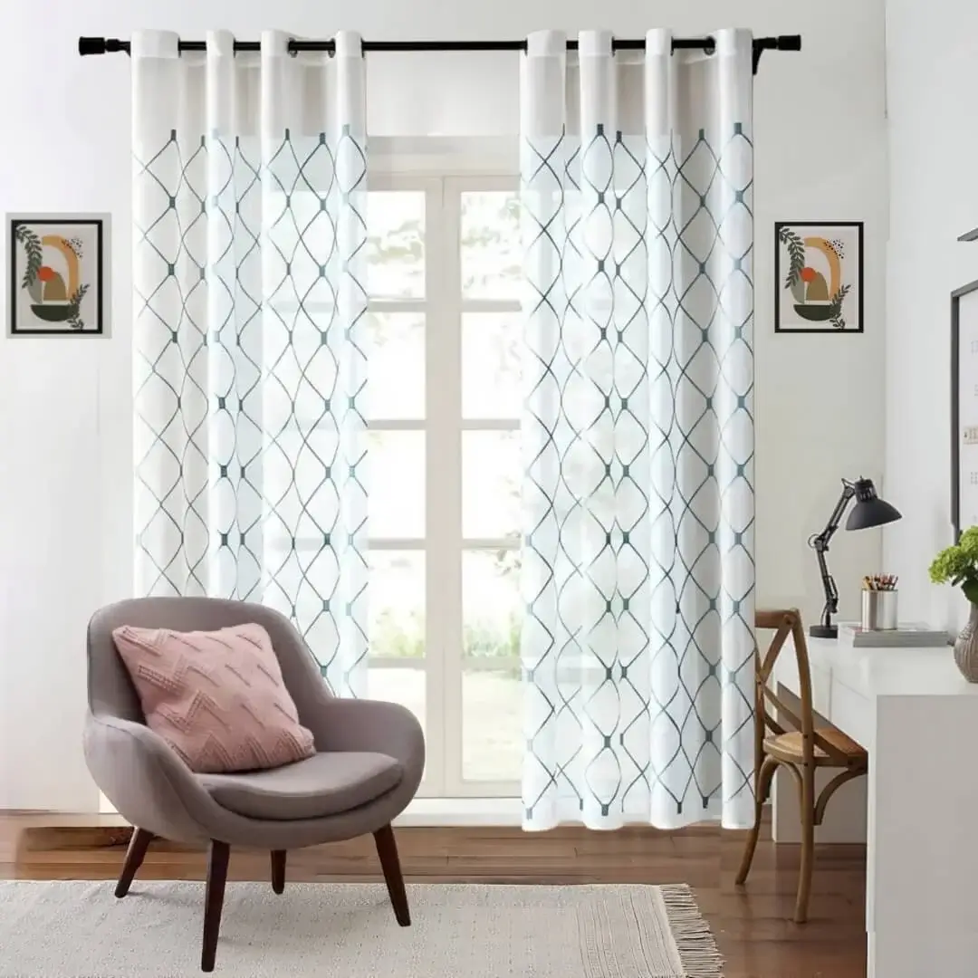 drapery rods for sheer curtains curtain rod for sheer curtains showcase: Elegant blue embroidered curtains hanging from a sturdy black curtain rod in a cozy living room, paired with a modern single-seater sofa, wooden study table, and decorative wall painting for a stylish home decor setup